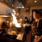 Chef Jamie Hoang works during lunch hours at Ahan on Friday, Feb. 24, 2023, in Madison, Wis. (Angela Major/WPR)