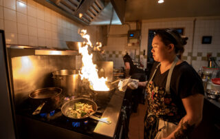 Chef Jamie Hoang works during lunch hours at Ahan on Friday, Feb. 24, 2023, in Madison, Wis. (Angela Major/WPR)