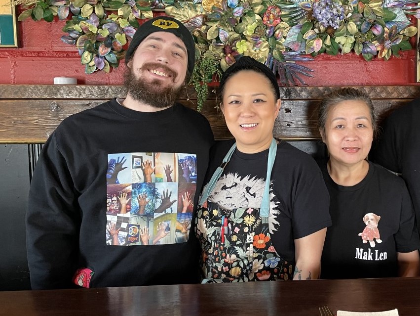 (l-r) Ahan's co-owner and general manager Chuckie Brown, co-owner and executive chef Jamie Hoang, and chef Manola Hoang. (Maureen McCollum/WPR)