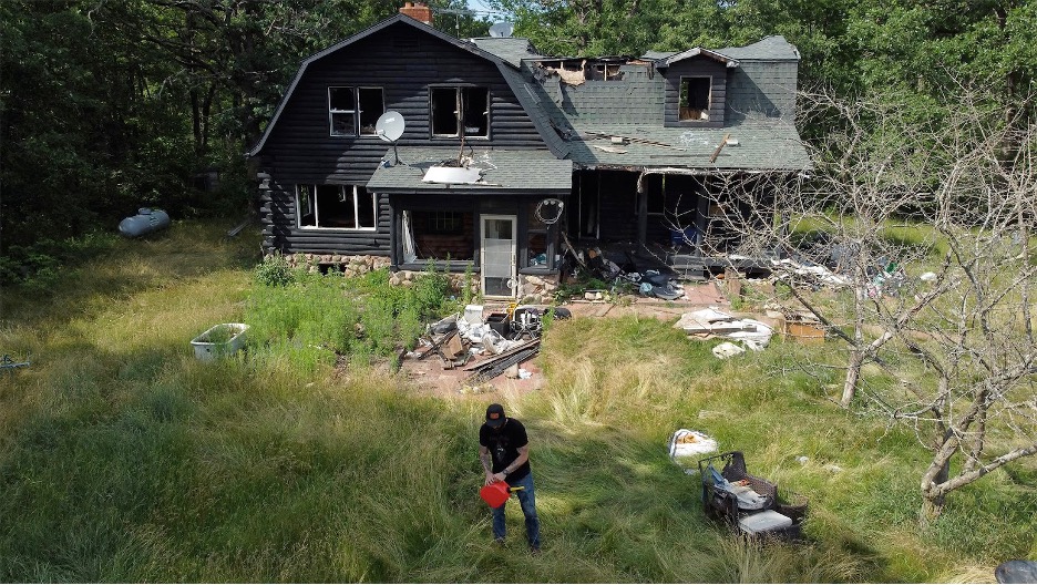 Comedian Jacy Catlin prepares to burn his house for a second time in the short film, "Everything I Learned When My House Burned Down: A Comedy." (Courtesy of Jacy Catlin)