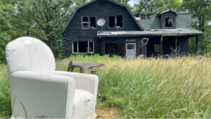 An armchair sits in the yard of Comedian Jacy Catlin's burned Wisconsin home. (Courtesy of Jacy Catlin)