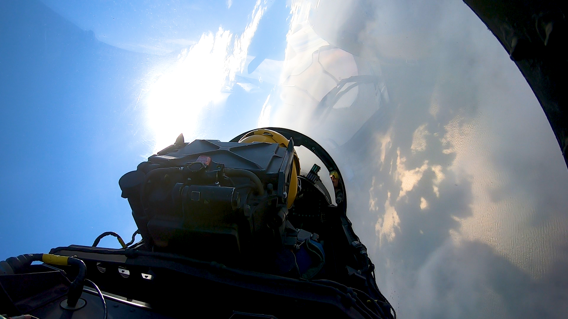 LCDR Griffin Stangel pilots his Blue Angels F-18 fighter jet over the Gulf of Mexico, as seen from the back seat. (Photo by Dusty Weis)