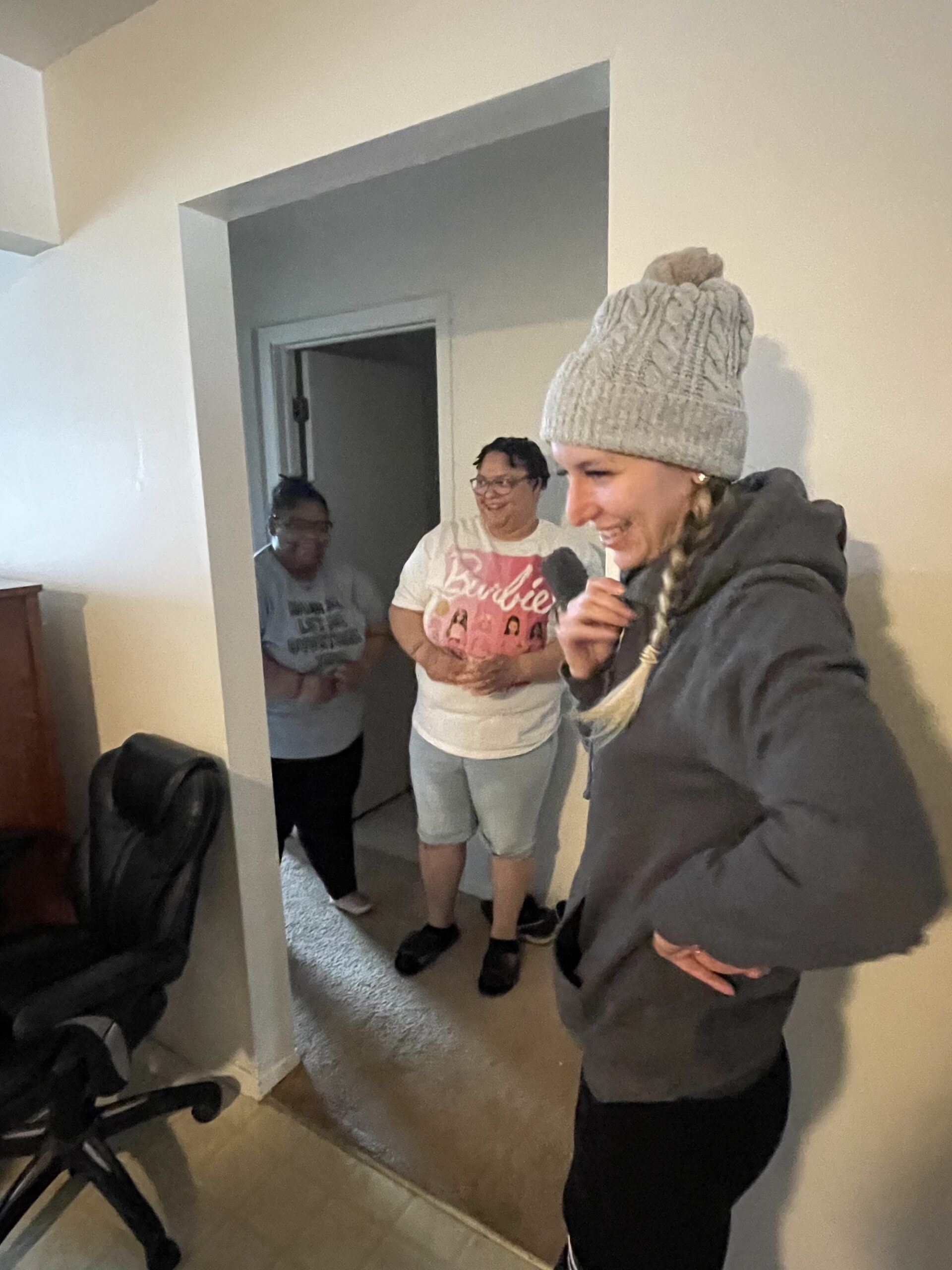 Sisters Jyeisha and Jessica Edwards walk out of a bedroom to see their apartment is fully furnished, thanks to work by nonprofit Felicia’s Donation Closet. (Gaby Vinick/WPR)