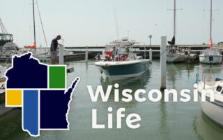 Wisconsin Life logo in front of sailing education association.