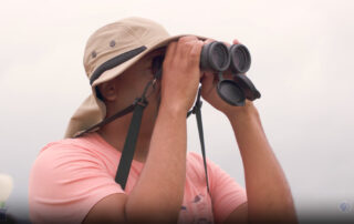 Bird Man looking through binoculars...