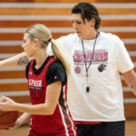 Janel McCarville, Stevens Point Area Senior High girls basketball coach and former WNBA player, instructs a player during practice Thursday, Nov. 9, 2023, in Stevens Point, Wisconsin. (Angela Major/WPR)
