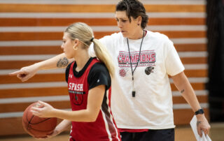 Janel McCarville, Stevens Point Area Senior High girls basketball coach and former WNBA player, instructs a player during practice Thursday, Nov. 9, 2023, in Stevens Point, Wisconsin. (Angela Major/WPR)