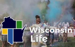 Woman with a cloud of color powder behind. Wisconsin Life logo in front.