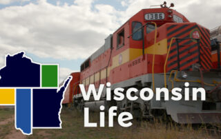 Train behind Wisconsin Life logo.