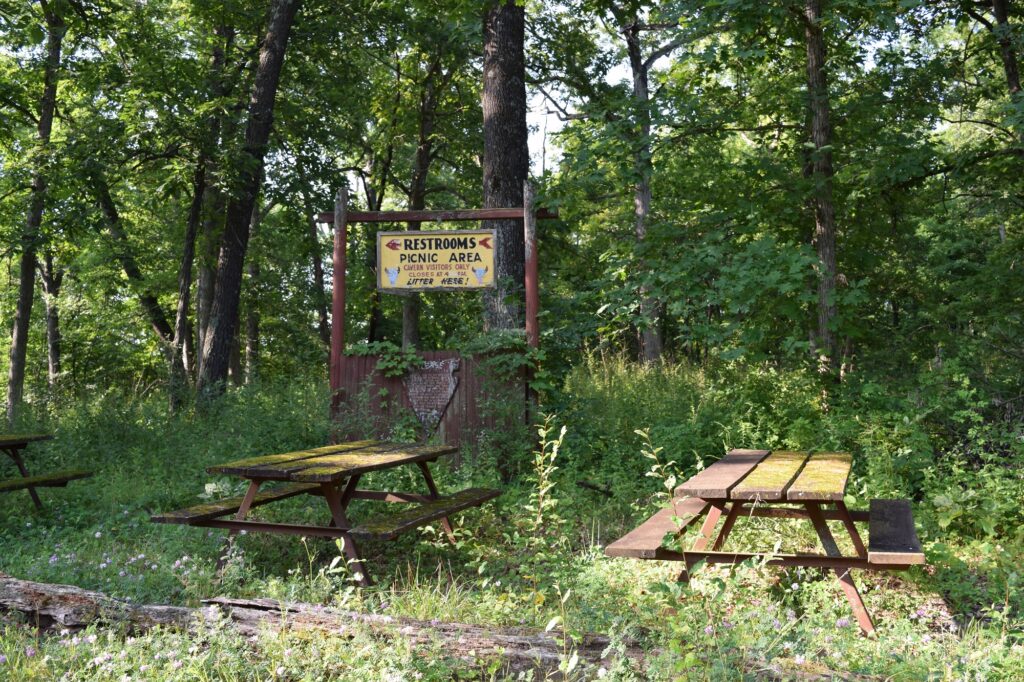 The property still has picnic tables and restrooms leftover from its decades as a tourist attraction. (Hope Kirwan/WPR)
