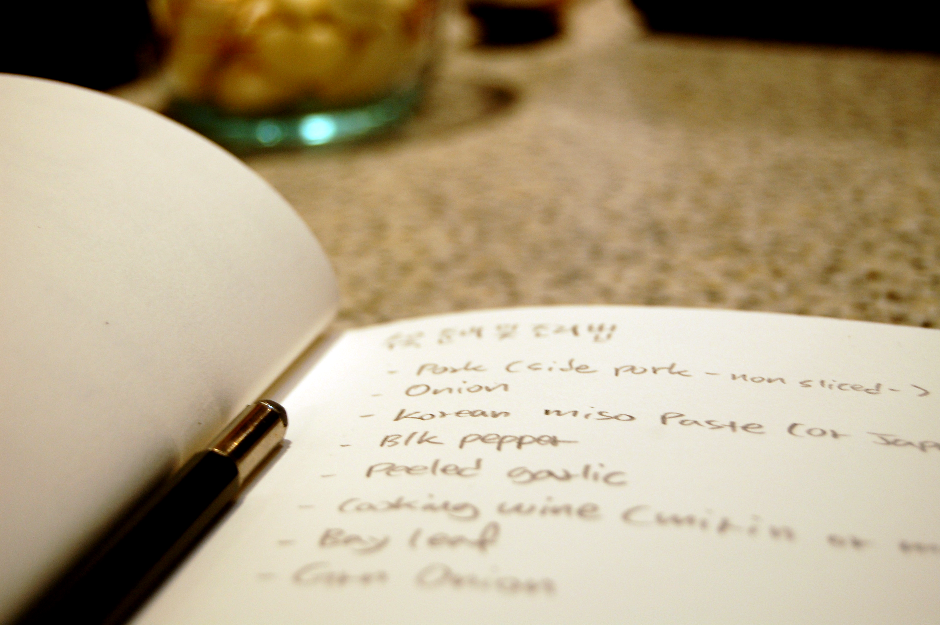 DJ Choi’s notebook sits on the counter with handwritten recipe notes.