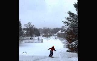 Beau Quinn snowboarding down a hill in Nelsonville, Wisconsin. (Photo by Jill Sisson Quinn)
