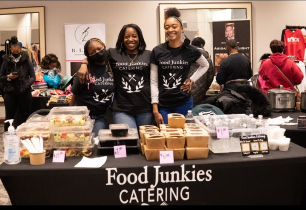 Food Junkies owner Angela Morgan (center) works an event with her daughters Zora (l) and Kamryn (r). (Courtesy of Angela Morgan)