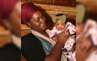 Tamara Thompson holds her one month-old daughter, Demara, at a press conference announcing the Birth Equity Act at the Wisconsin State Capitol on October 12, 2021. (Courtesy of Tamara Thompson)