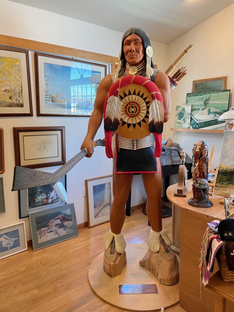 "Ho-Chunk Warrior," a wood sculpture by Harry Whitehorse. It's on display in the Whitehorse Gallery in Monona, Wisconsin. (Maureen McCollum/WPR)