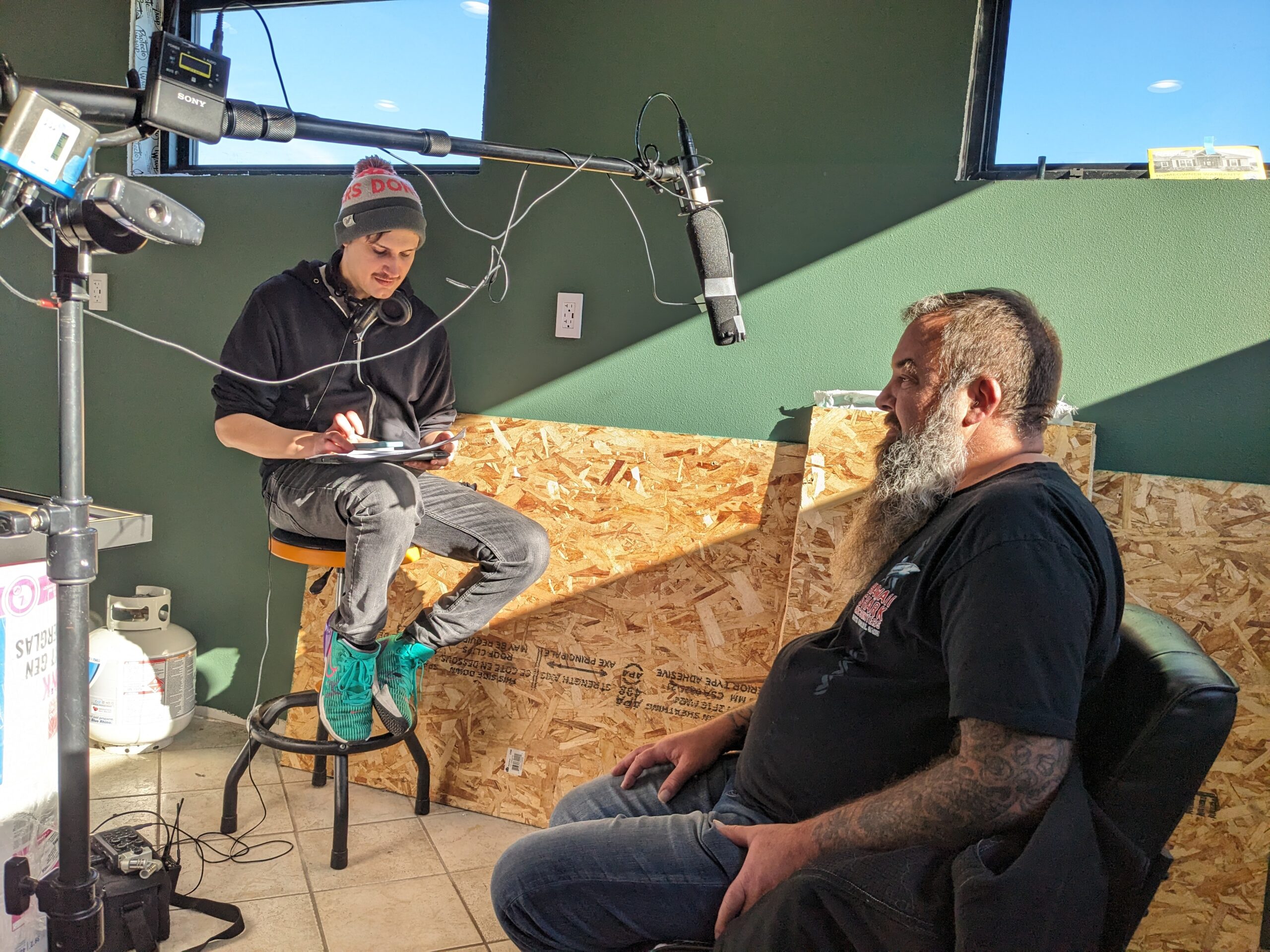 Max Hey (left) interviews a subject for his documentary "Now! More! Yes!" Photo credit: Chris James Thompson