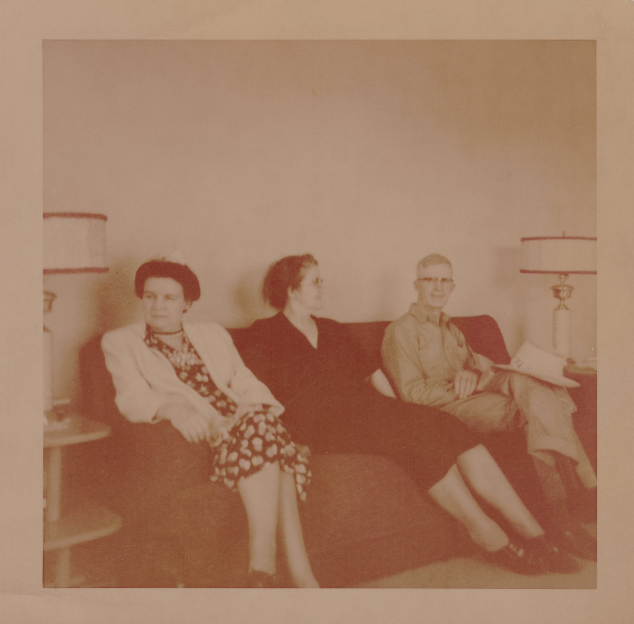 Elizabeth Newman (l), also known as Aunt B, sits on a couch with Julia and Gerald Smirl, writer Nancy Jorgensen's grandparents. Courtesy of Nancy Jorgensen