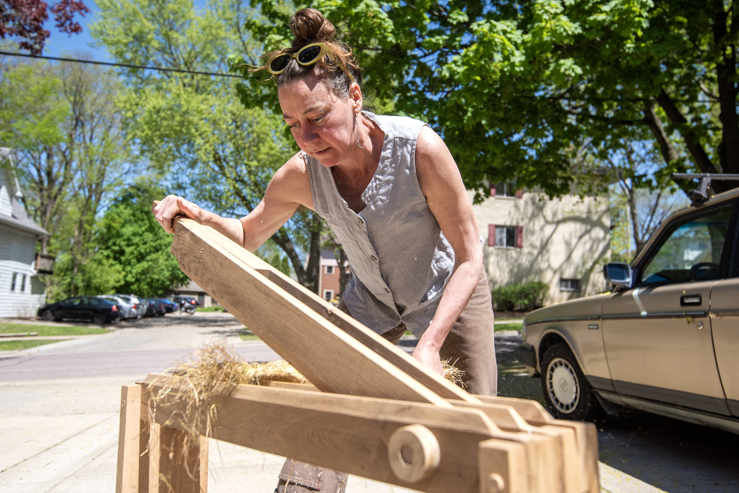 Leslie Schroeder, also known as 'The Flax Ma'am,' breaks flax Thursday, May 8, 2025, in Madison, Wis. Angela Major/WPR