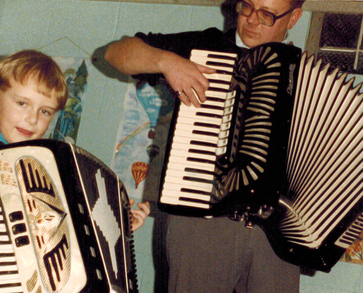 Mike Schneider as a child plays accordion with his dad, Paul Schneider. <i>Photo courtesy of Mike Schneider</i>