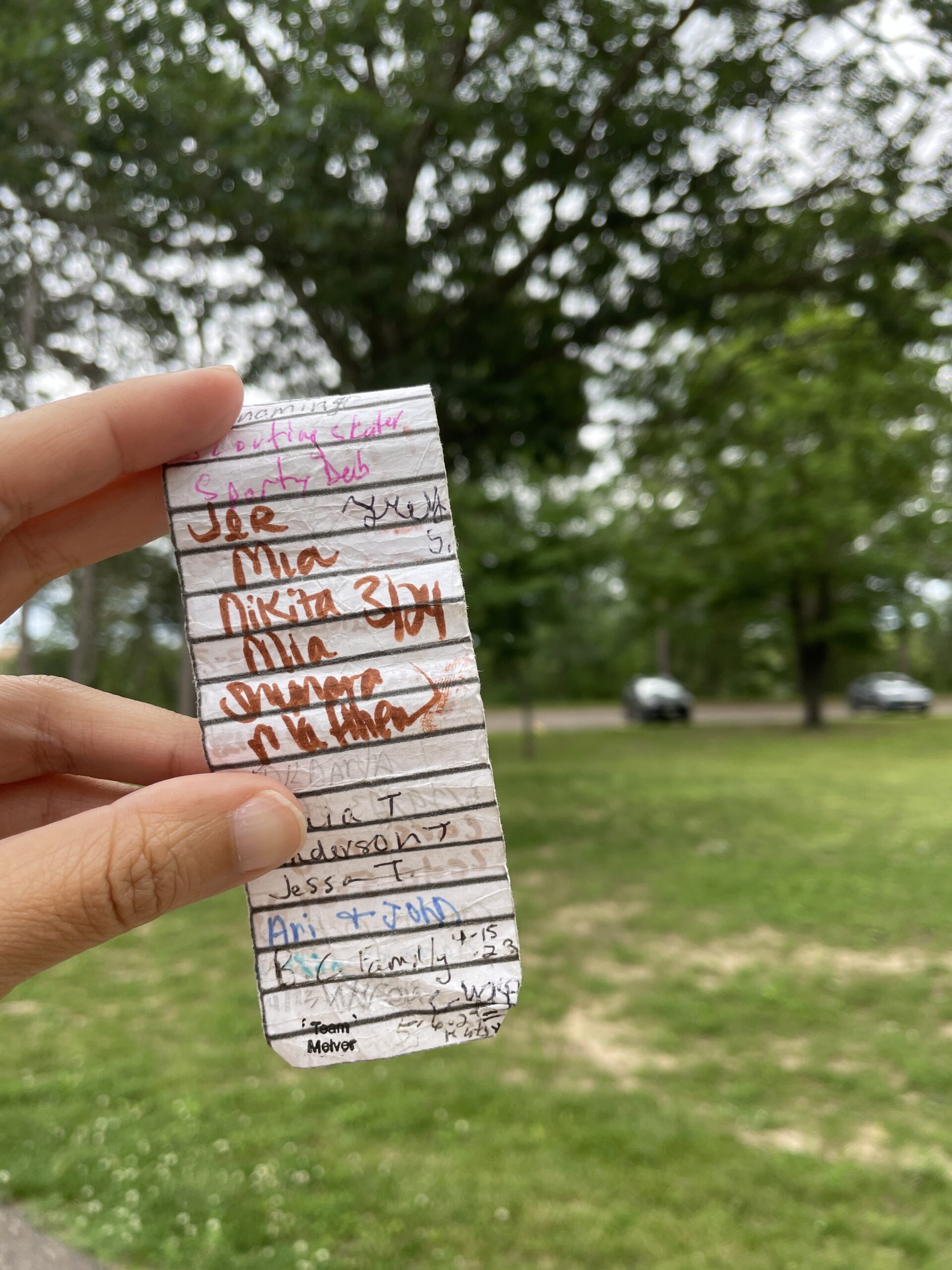 Jer Lor's name listed on a geocaching logbook that her sister, Yia Lor, found near a park in Eau Claire. Photo by Yia Lor