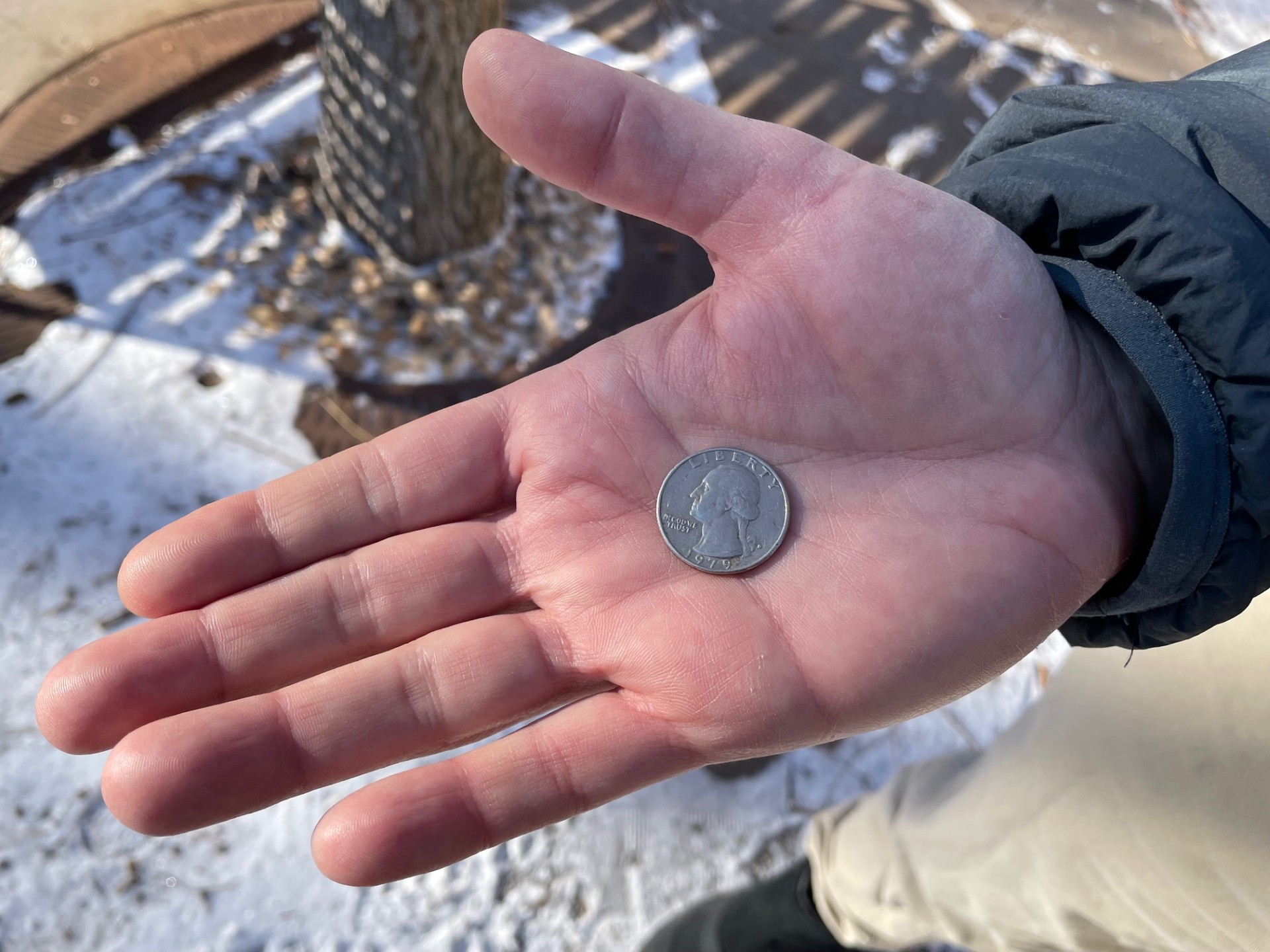 WPR producer Lee Rayburn holds a quarter from 1979. Maureen McCollum/WPR
